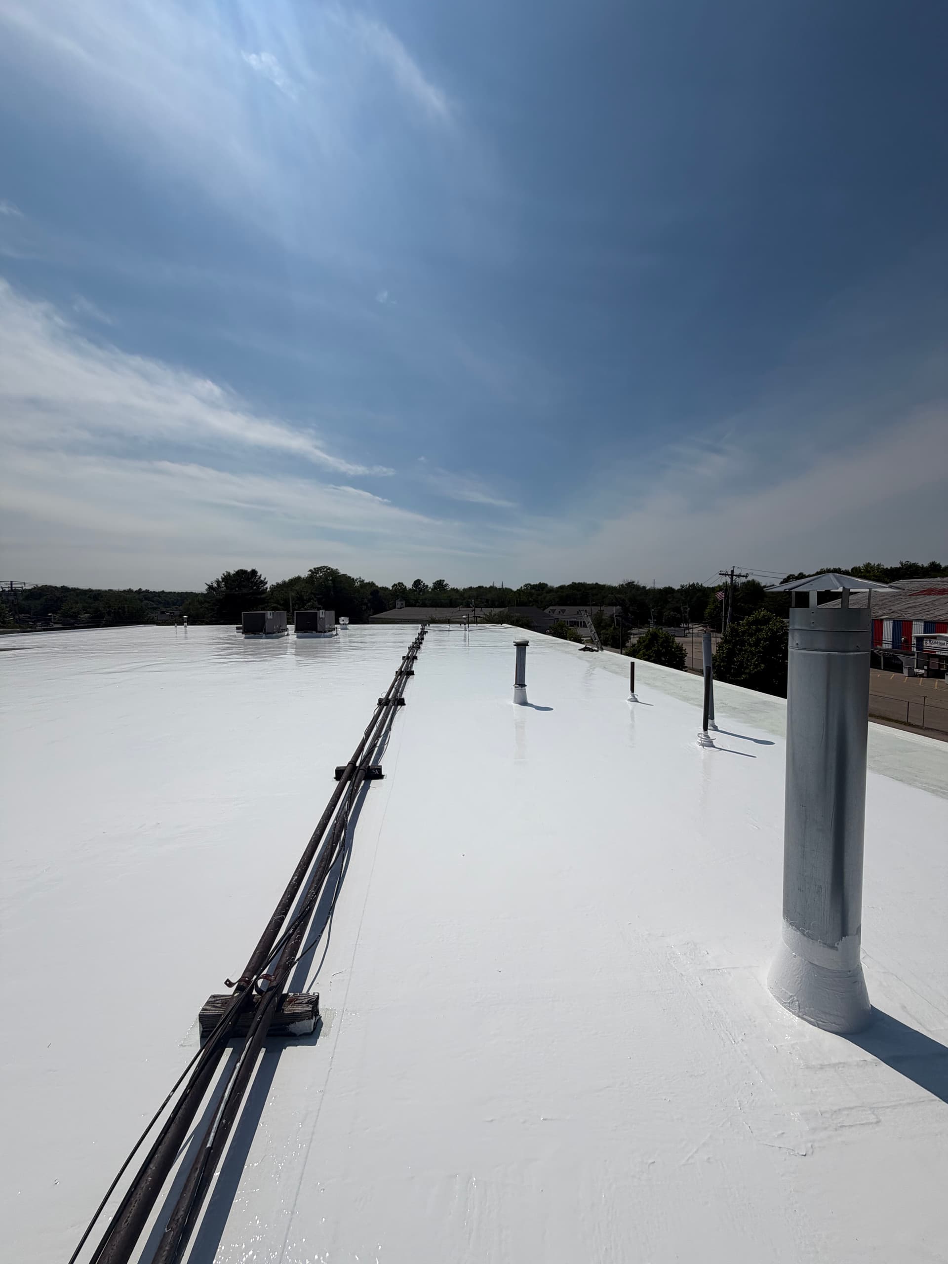 Gallery photos for Silicone Roof Coating Applied to Commercial Building in Raynham: Image #1