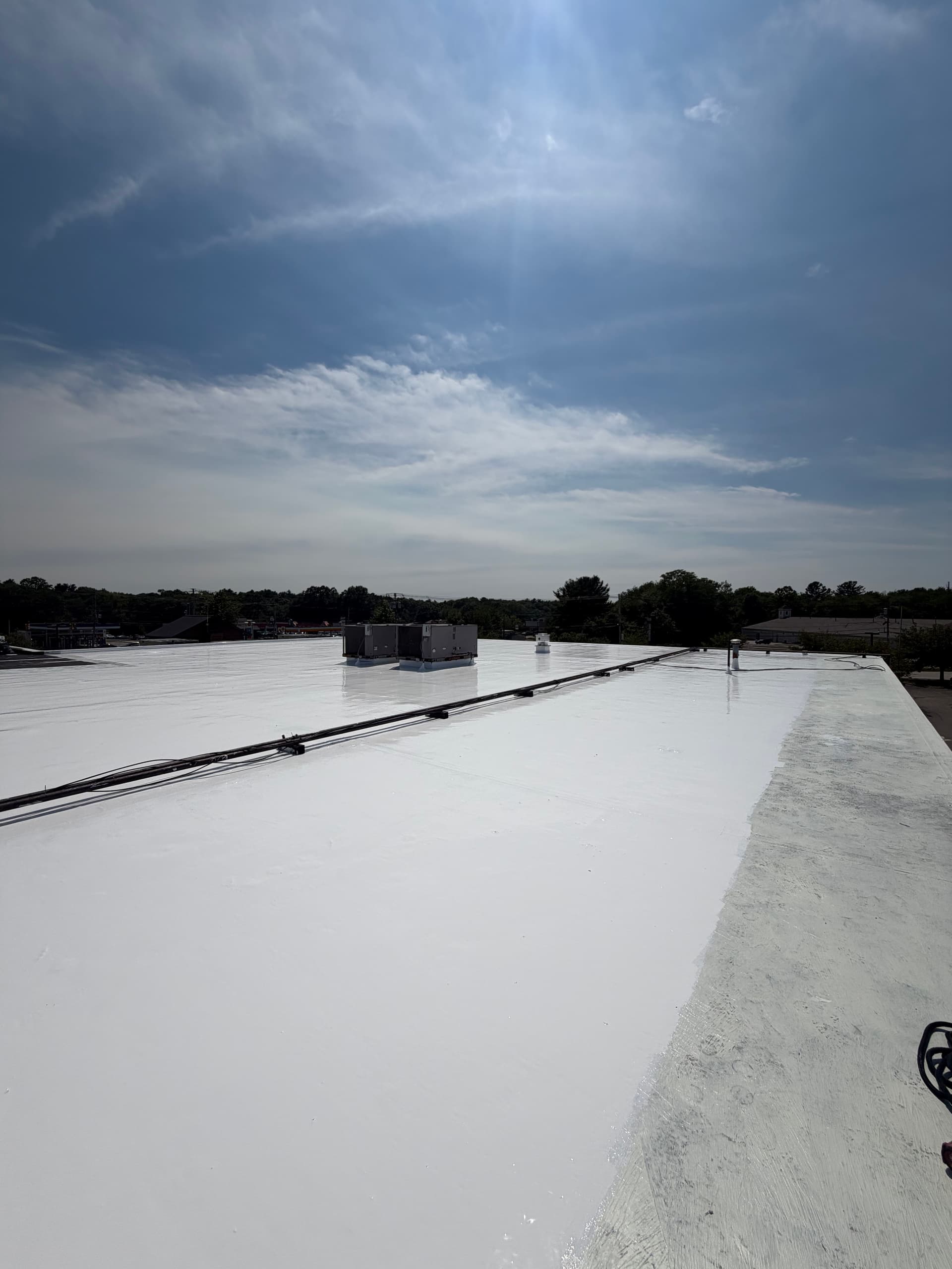 Gallery photos for Silicone Roof Coating Applied to Commercial Building in Raynham: Image #2